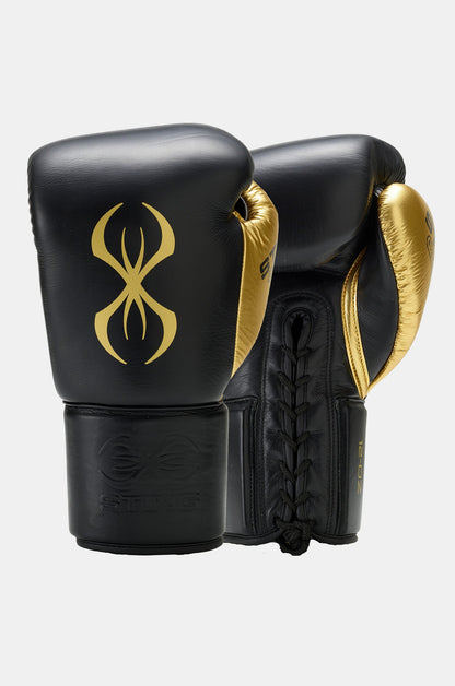 STING Evolution Lace Up Fight Gloves in black and gold