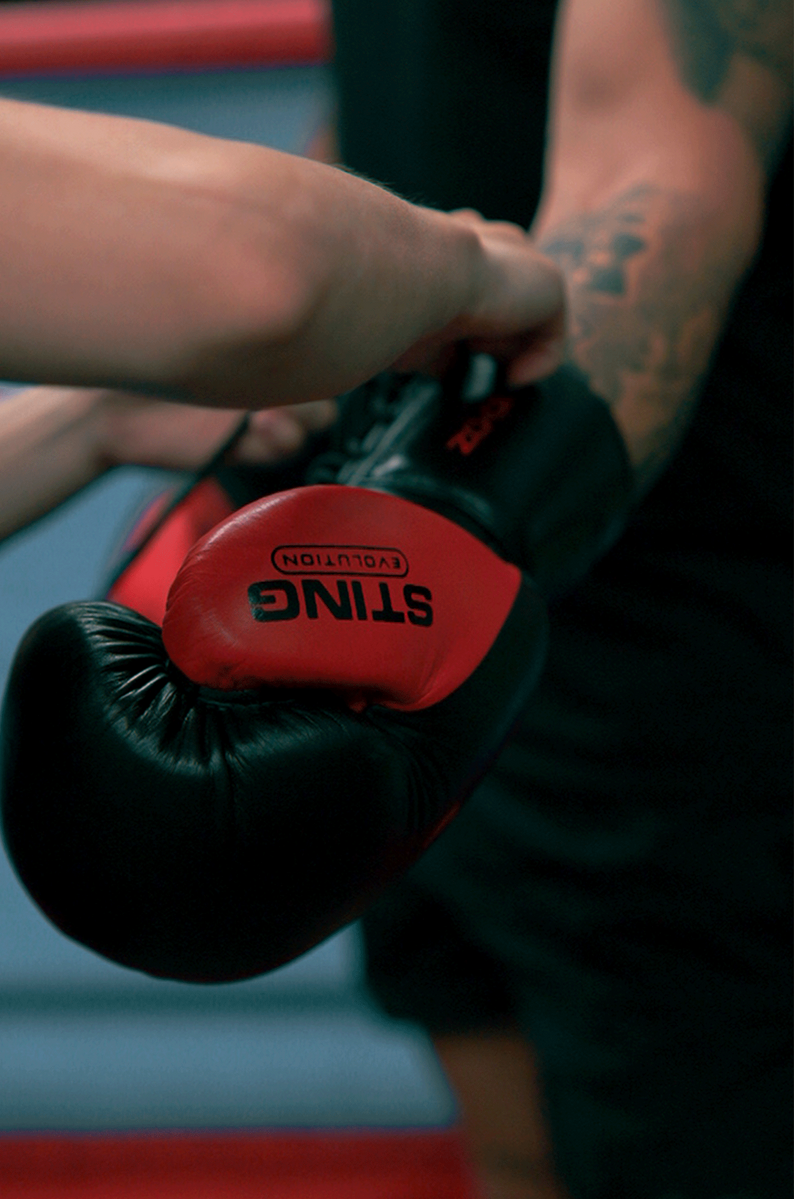 STING Evolution Fight Glove Lace Up — Black/Red